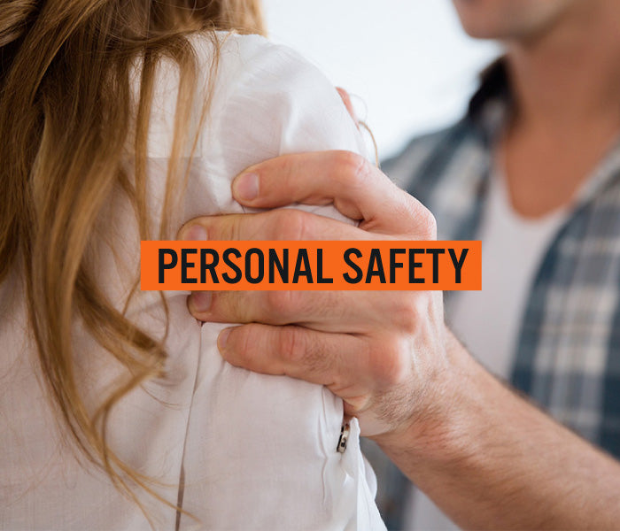 Person grabbing another with a hand on their shoulder, text overlay 'PERSONAL SAFETY'.